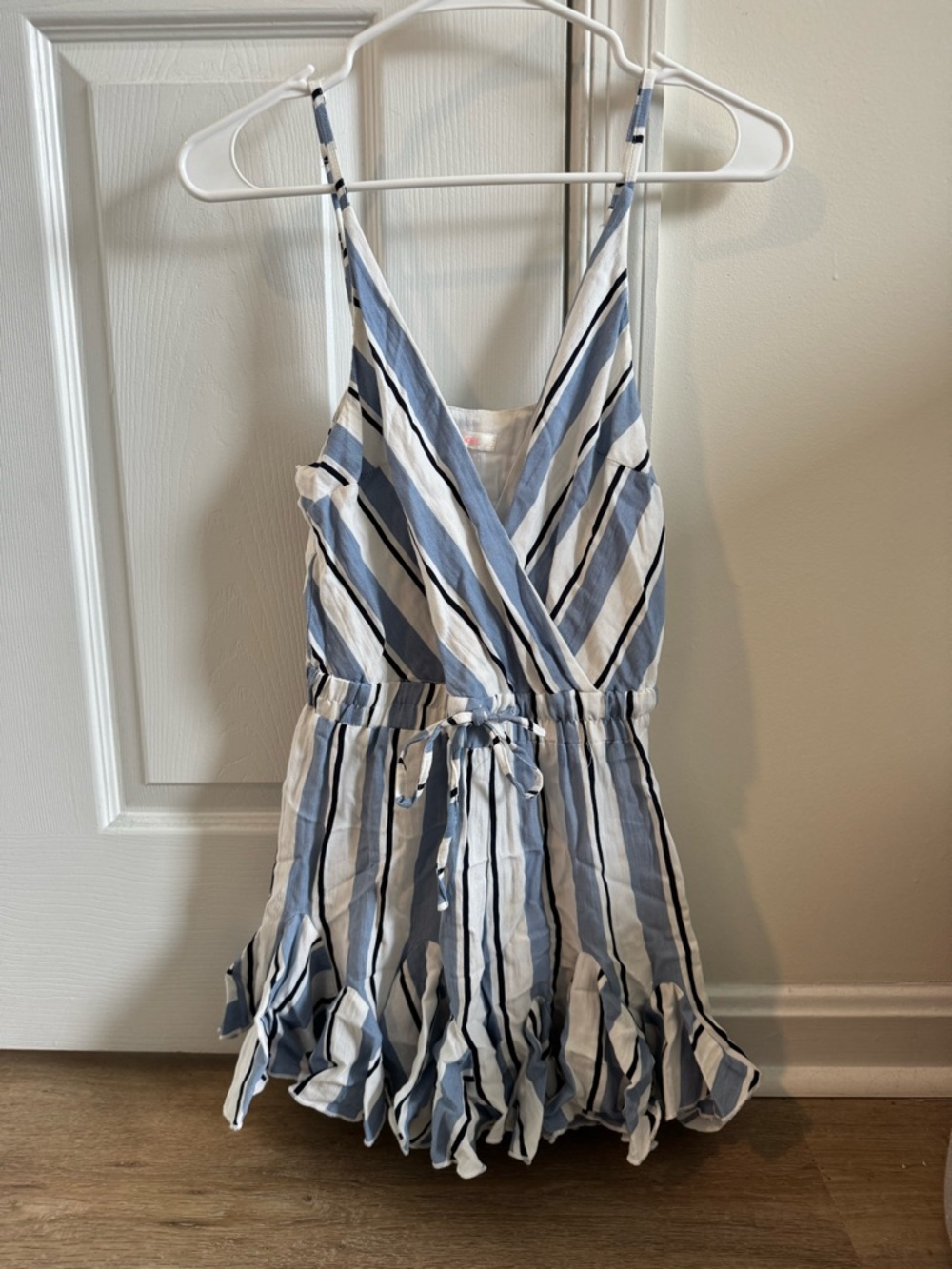 Women’s blue and white stripe romper with ruffle skirt